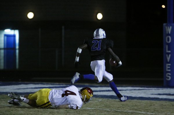 Basic's Anthany Lessier (21) scores a touchdown during Friday's game ...