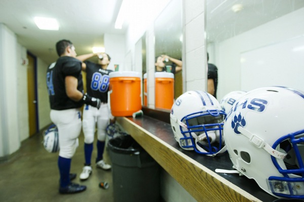 Basic players take a break in the locker room during ...