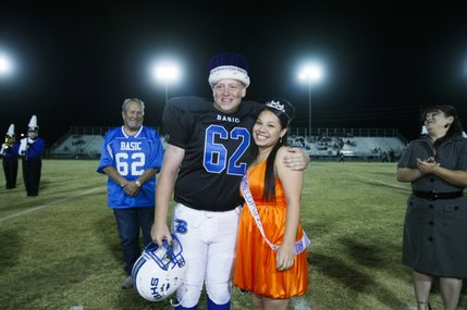 Basic's newly crowned homecoming king and queen, Eric Rubeck and Desiree Sanchez, pose for a photo during Friday's game against Basic.