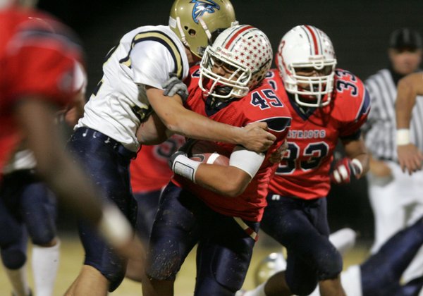 Foothill's Dillion Armstrong attempts to tackle Liberty's Sage Nua during ...