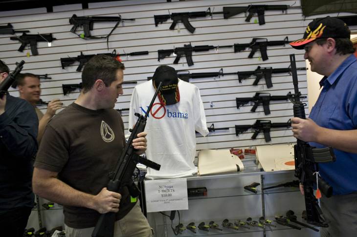Canadian tourists Colin Grosh, left, and David Mitchnick check out the wares Wednesday at the Las Vegas Gun Range & Firearms Center. The NRA says that in the past year it has registered more than 1 million gun owners to vote, and at the center "NObama" T-shirts are hot items, with most of the 300 ordered having been sold.