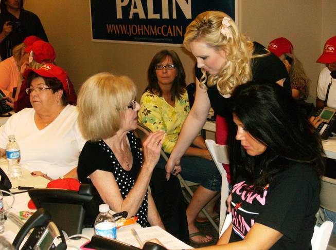 Meghan McCain, center, daughter of presidential candidate Sen. John McCain, greets volunteer Sunnie Dotson, 56, of Henderson at the McCain campaign headquarters Monday.