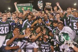 The Green Valley High School football team celebrates its 47-26 victory over Basic High School in the 2007 Henderson Bowl.