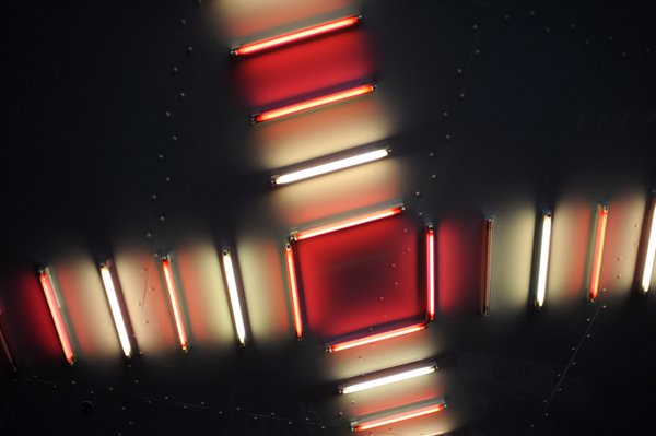 Artsy neon lights shine down on the concourse area of ...