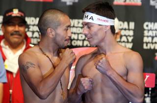 Super flyweight boxers Isidro Garcia, left, of Los Angeles, and Jorge Arce of Mexico pose during an official weigh-in at the Mandalay Bay Friday, Oct. 31, 2008. The boxers meet for a 12-round bout at the Mandalay Bay Events Center on Saturday. 