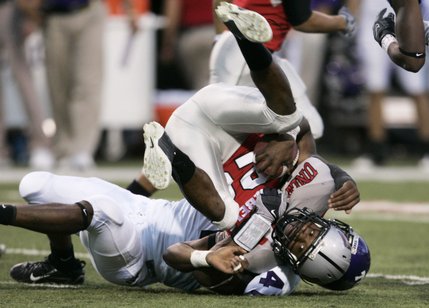 UNLV defensive back Deante Purvis gets up-ended after running back a kickoff during the first half.