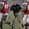 UNLV head coach Mike Sanford cheers his team after it scored during the first quarter of the game against TCU.