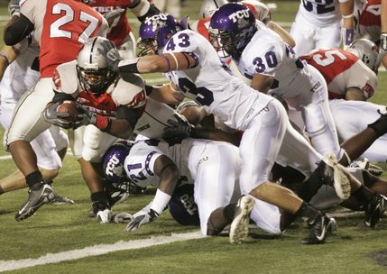 UNLV running back David Peeples dives into the end zone for a touchdown against TCU on Saturday.