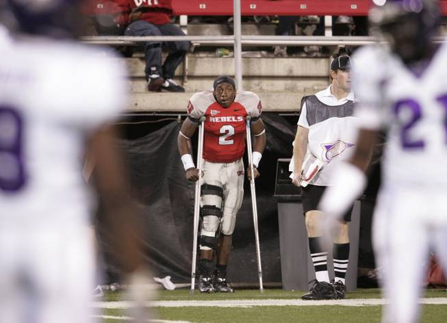 UNLV starting quarterback Omar Clayton watches the game against TCU after injuring his knee on Nov. 1, 2008.