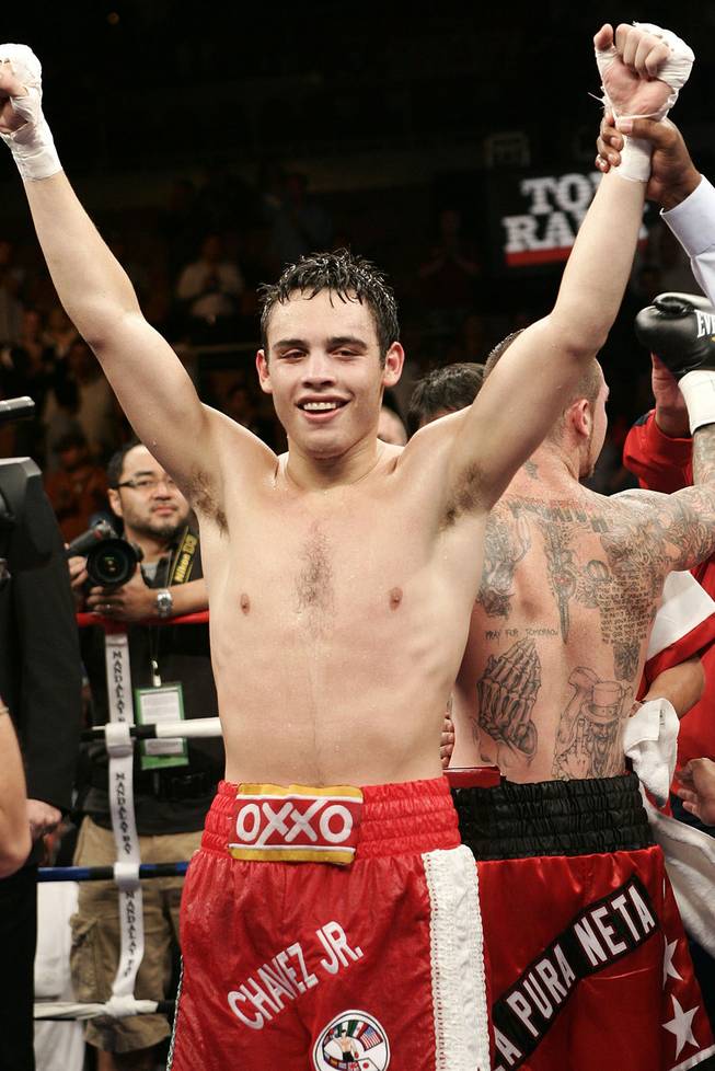 Julio Cesar Chavez Jr., of Mexico, celebrates after his 10-round decision over Matt Vanda during a super welterweight boxing bout Saturday, Nov. 1, 2008.