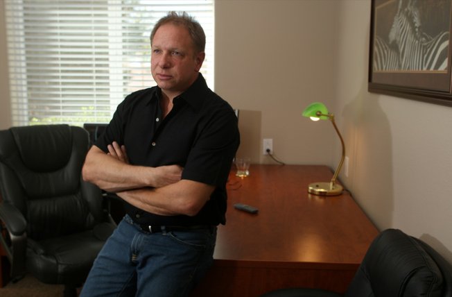 Jeff Ballek feels his clients' pain, as his financial services business suffers.
