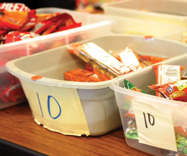Buckets in Robert Taylor Elementary School's Gotcha' Store are filled with many different snacks, from Cheez-Its to granola bars.