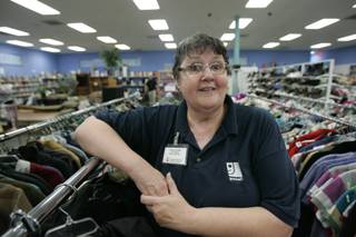 Susan Locklin, manager of the Goodwill store at Eastern and Serene avenues, poses for a photo Saturday.
