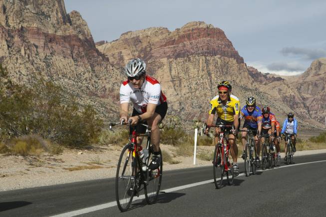 From left, Steven Moore, Jim Haile, Bruce Hanf, Curt Ingle, Donna Ingle, and another cyclist descend the straightaway toward Blue Diamond during the Las Vegas Valley Bike Club's 50-mile Saturday morning ride.