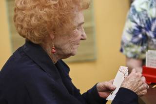 Dot Bradley sorts her hand while playing duplicate bridge at the newly opened Henderson Bridge Club Oct. 28.