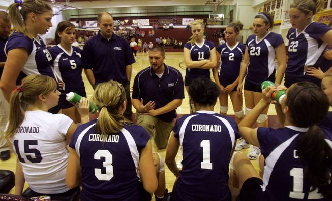 Head Coach Brock Mitchell talks to the Coronado girls' volleyball team during a time out in the Sunrise Region girls' volleyball tournament against Eldorado on Monday. Coronado won to advance to the semifinals.