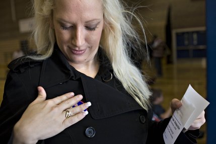  Obama supporter  Leslie Winter proudly puts on her 