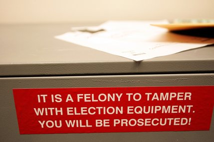 A sign warns people not to tamper with election equipment inside the West Las Vegas Library on Election Day.