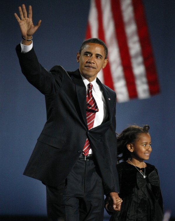 President-elect Barack Obama walks on stage with his daughter Sasha, ...