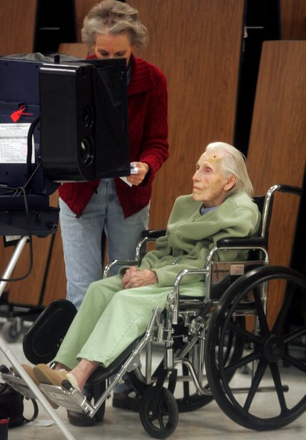 From left to right, Pam Murphy helps her mother, Mildred Gale, cast her vote Tuesday at Elton M. Garrett Middle School in Boulder City.
