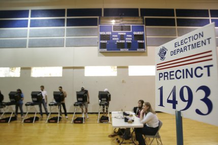 Voters cast their ballots on Election Day in the Basic High School gymnasium.