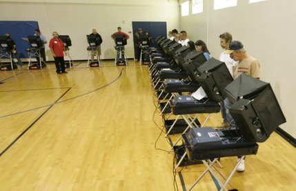 Voters cast their ballots on Election Day in the Basic High School gymnasium.