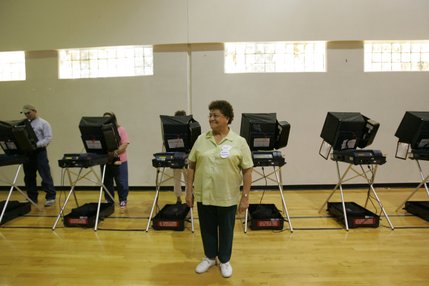 Maria Cardenas, a translator and election board officer with the Clark County Election Department, waits to help voters casting ballots Tuesday in the Basic High School gymnasium. 