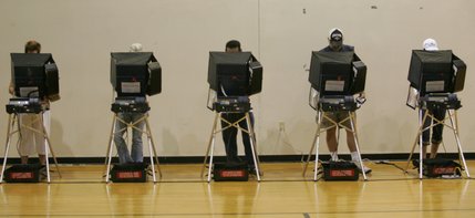 Voters cast their ballots on Election Day in the Basic High School gymnasium.