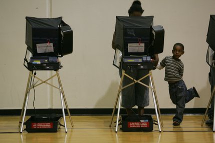 Malachi Elderridge, 5, waits for his mother, Tiaara, to cast her ballot on Election Day in the gymnasium at Basic High School in Henderson.