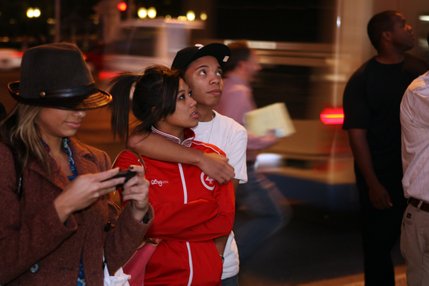 First-time voters Ian Medina, 19, and Gemvvi Torio, 18, of Las Vegas, watch television news coverage outside Planet Hollywood as Democratic President-Elect Barack Obama gives his acceptance speech Tuesday night.  Medina and Torio both voted for Obama, they said. 