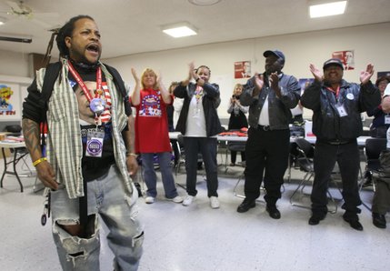Kevin Purvis, left, leads union members during a morning meeting at the Culinary Workers Union Local 226 headquarters before a final day of election work and canvassing Tuesday, Nov. 4, 2008. 