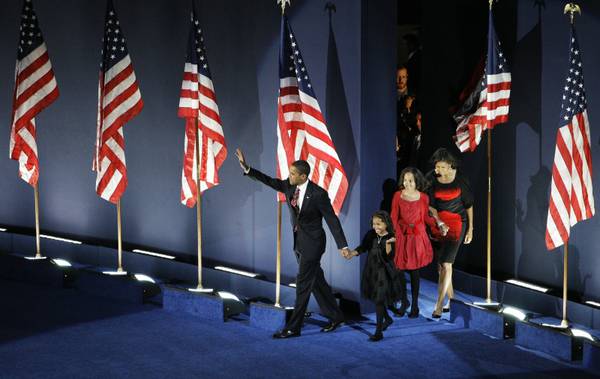 President-elect Barack Obama walks out on stage with his family ...