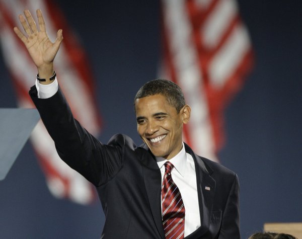 President-elect Barack Obama waves as he takes the stage at ...