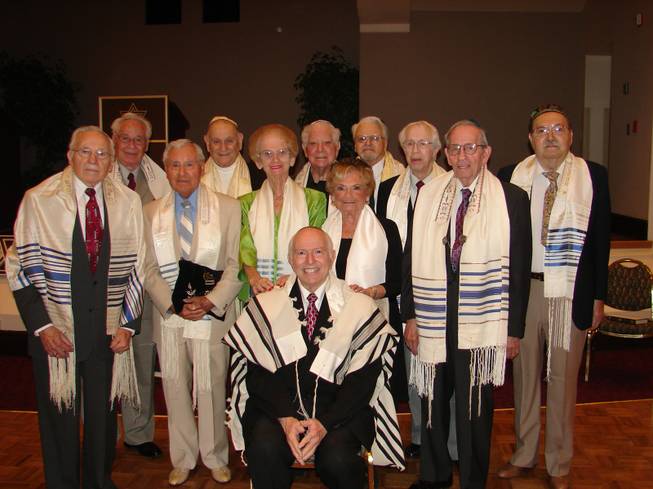 Eleven members of Temple Bet Knesset Bamidbar in Sun City Summerlin joined Rabbi Hershel Brooks in a "Second Bar Mitzvah and Bat Mitzvah" on Saturday.
Sitting is Rabbi Hershel Brooks. Standing in the front row, from the left, are: Bernard Sipelstein, Alex Kuechel, Selma Soriano, Claire Bass and Murray Silver. Standing in the back row are: Harry Sipelstein, Vic Soriano, Ed Kaplow, Philip Seidman, Irving Bonn and Stewart Miller.