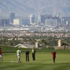 With the Las Vegas skyline as a backdrop, celebrities and professional golfers play on the green during the Danny Gans' Partee Fore Kids Celebrity Pro-Am at DragonRidge Country Club on Monday.