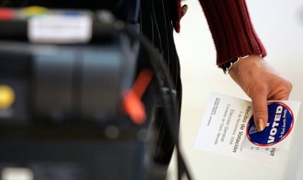 A voter holds on to her voting material, translated into Spanish, while casting her vote on election day at First Christian Church on South Rancho Drive in Las Vegas Tuesday.