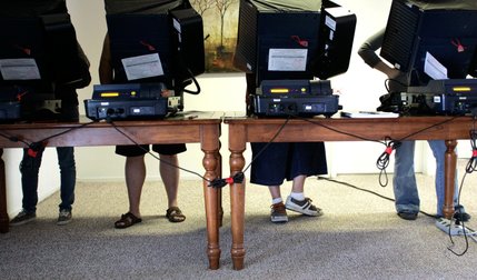 Voters cast their ballots during election day at Silverado Mobile Home Park on North Walnut Road in Las Vegas Tuesday.