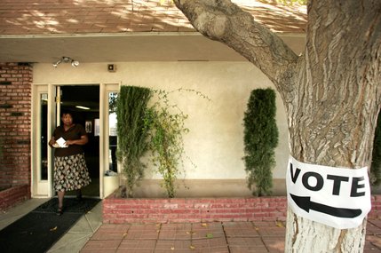 Sally Davis, 60, exits after voting at Silverado Mobile Home Park on North Walnut Road in Las Vegas Tuesday. This the first election in which she has ever voted.