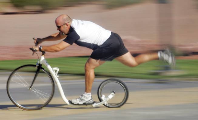 Jeff Oakie propels his footbike at Henderson Pavilion. Similar to a bicycle, foot power moves the vehicle but without pedals.