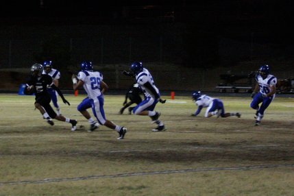 Palo Verde's Torin Harris (5) tries to avoid Sierra Vista defenders Ivan Vela (28) and Carlos Baez (56).