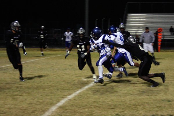 Palo Verde's Sidney Hodge (4) tries to tackle Sierra Vista's ...