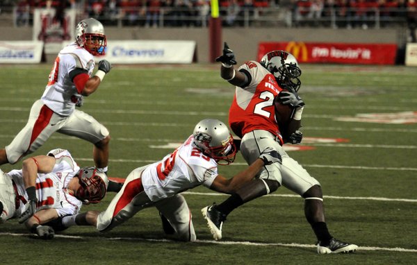 UNLV wide receiver Michael Johnson is brought down by New ...