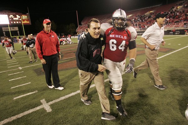 UNLV head coach Mike Sanford and offensive lineman Sifa Moala ...
