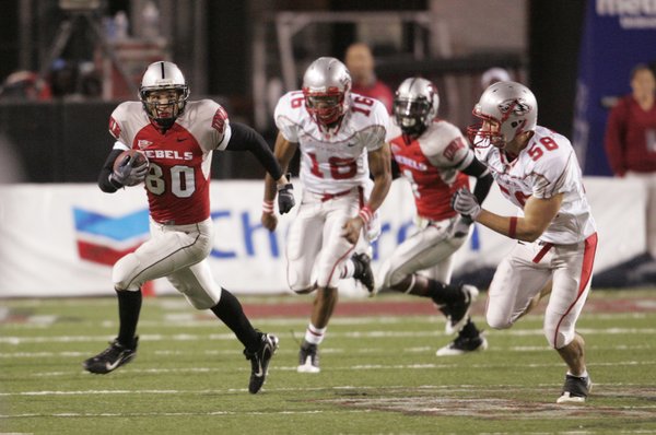 UNLV wide receiver Casey Flair eludes New Mexico defenders.