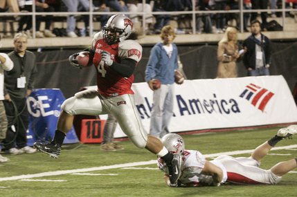 UNLV running back Frank Summers slips past New Mexico cornerback Glover Quin for a touchdown.