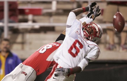UNLV wide receiver Phillip Payne has a pass broken up by New Mexico cornerback Anthony Hooks.