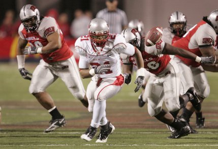 New Mexico running back Rodney Ferguson chases down a ball he fumbled during the game against UNLV on Saturday.