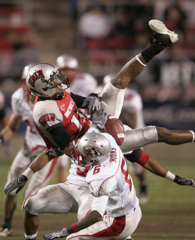UNLV wide receiver Phillip Payne gets upended by New Mexico cornerback Anthony Hooks on an incomplete pass during the Rebels' 27-20 victory over the Lobos at Sam Boyd Stadium on Nov. 8, 2008. Payne suffered a season-ending concussion on the play.