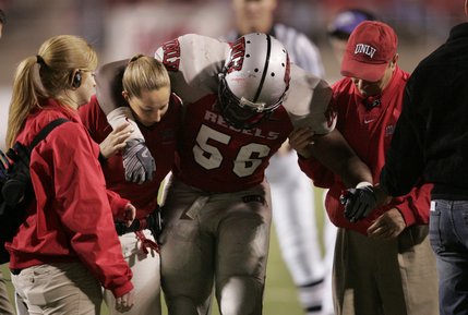 UNLV linebacker Ronnie Paulo is helped off the field after spraining his ankle against New Mexico.