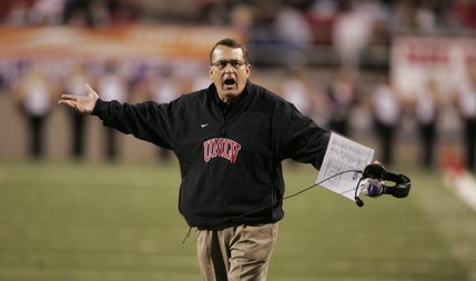 UNLV head coach Mike Sanford questions officials during the game against New Mexico Saturday.